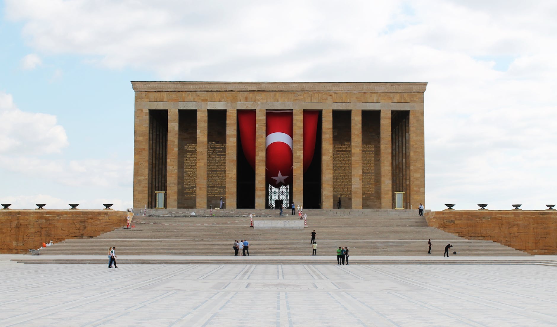 people standing on a public square near the mausoleum