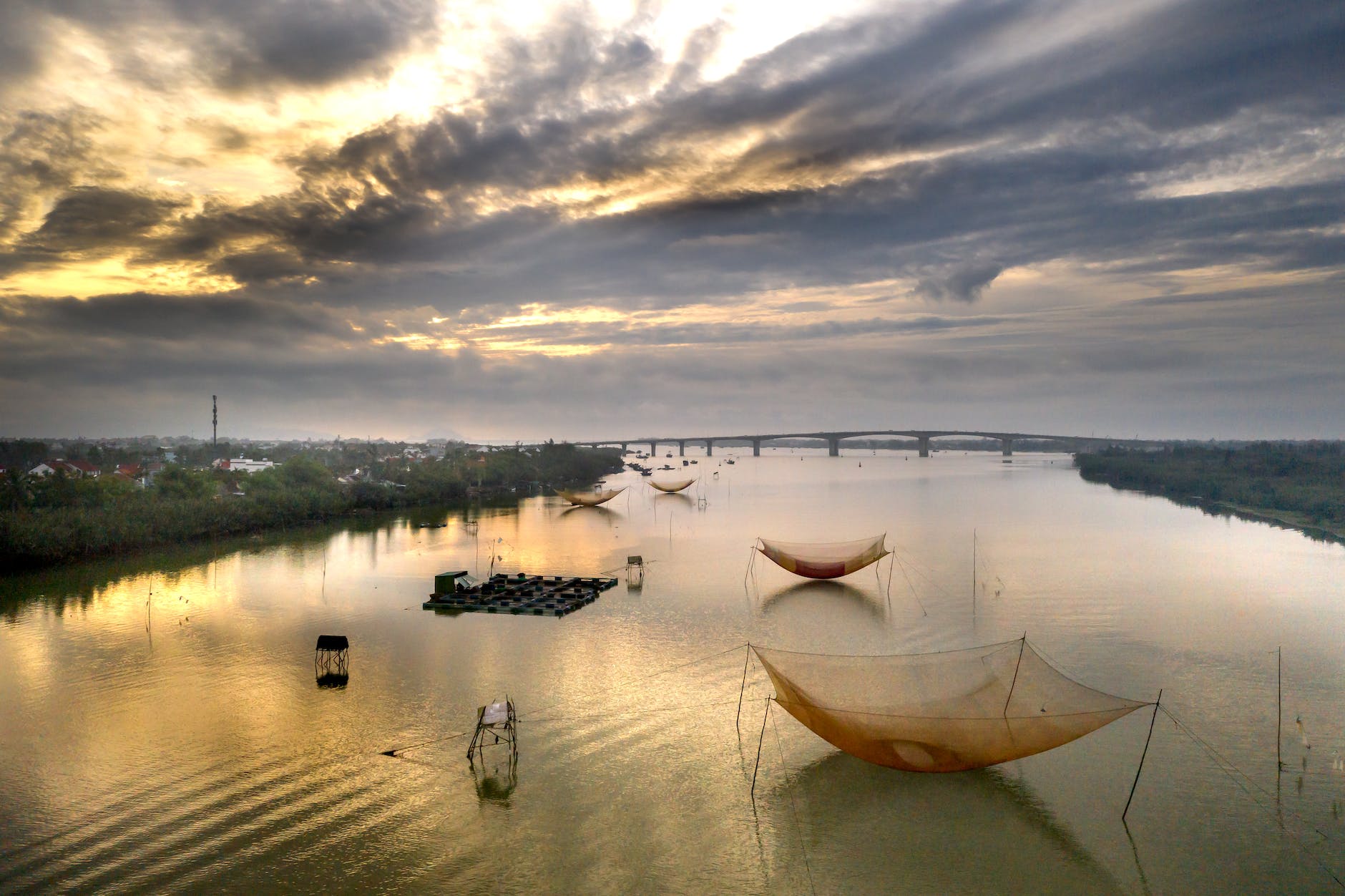 fishing nets in river on sunset