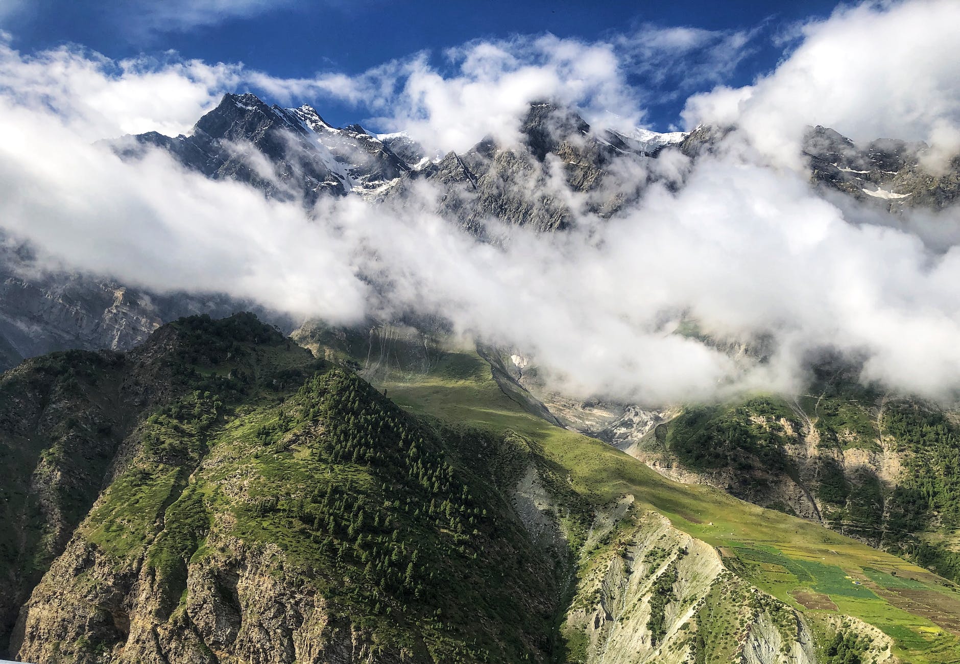 aerial view of mountain covered with clouds