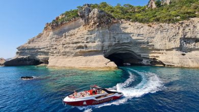 a motorboat sailing on the blue water of the sea